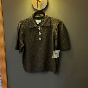 Women’s grey sweater with embellished buttons.